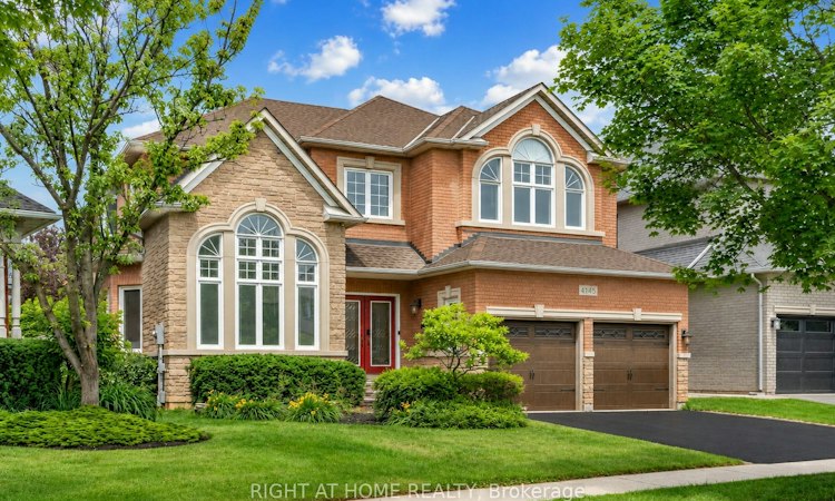 Brick detached home at 4145 Bonavista Crescent, Millcroft, Burlington, with architectural windows and a double garage